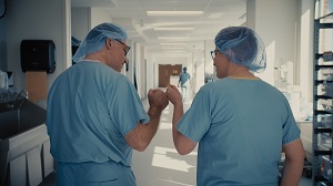 Two Henry Ford Health team member fist bump