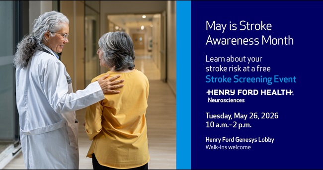 Stroke Screening Event at Genesys Hospital. Doctor standing with older lady.