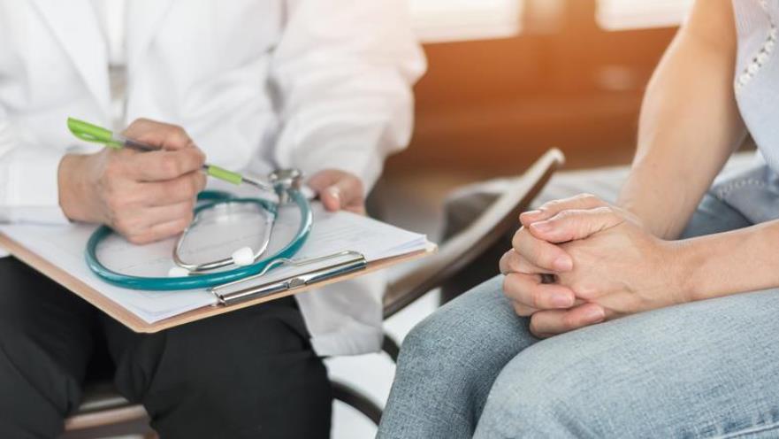 Doctor and patient discussing breast cancer diagnosis