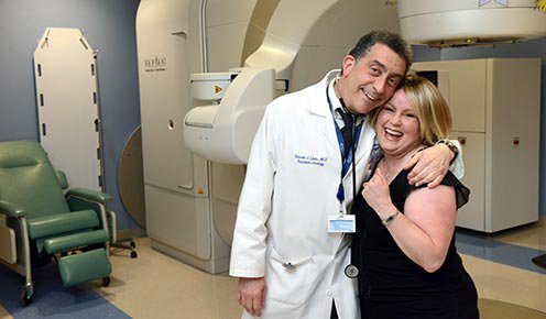 physician and patient smiling with imaging