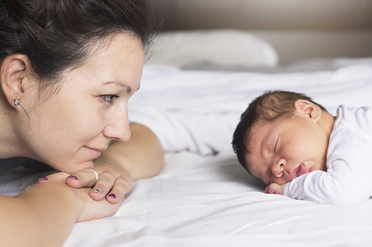 fertility preservation mother looking at sleeping child CTA