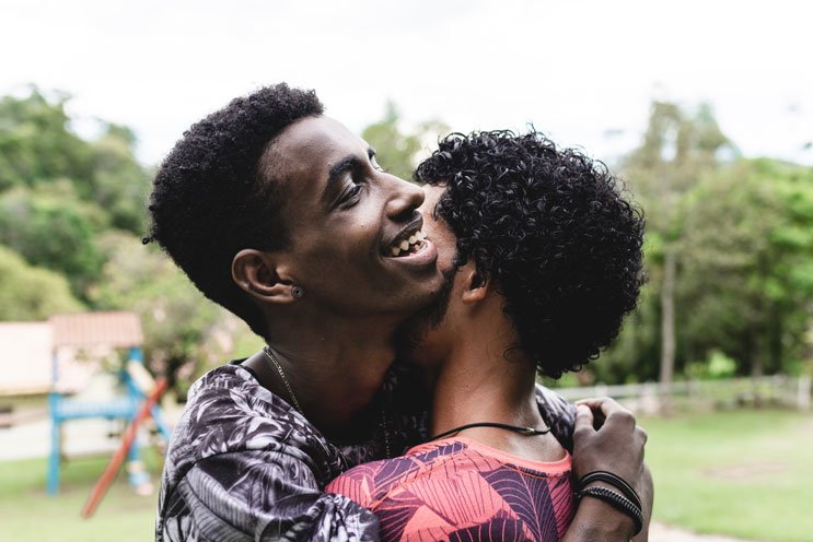 people hugging at park