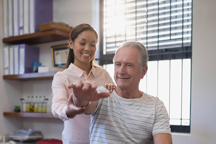physical therapy patient doing arm exercises