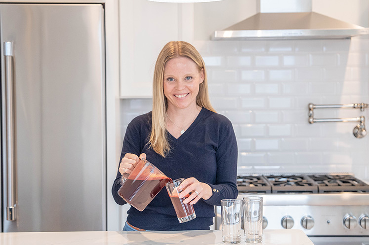 Colon cancer patient Brooke cooking in her kitchen