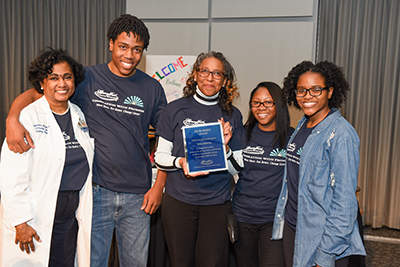 Group and Dr Wisdom holding award