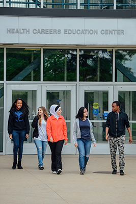 Early college students walking in a group