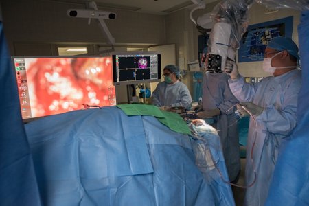 Neurosurgeons using NASA robotics