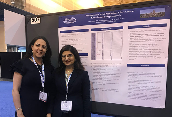 Dr. Bhan with 1st year Dr. Kumar presenting her poster.