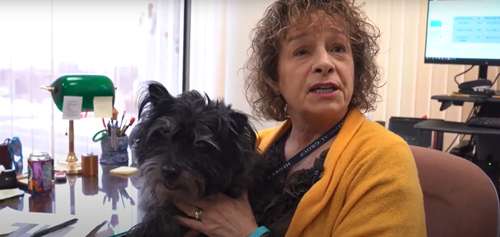 woman holding her dog