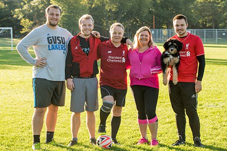 stroke patient mark on soccer field with family
