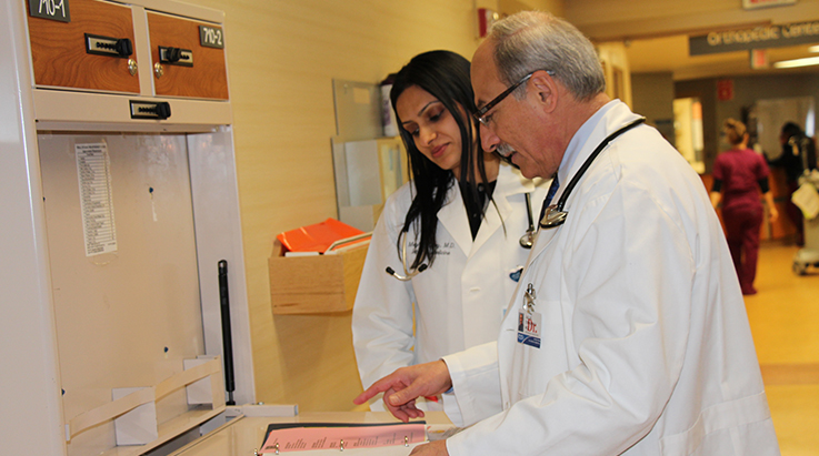 physicians reviewing documents