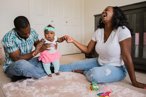 Miya laughing with baby Clark and Landon