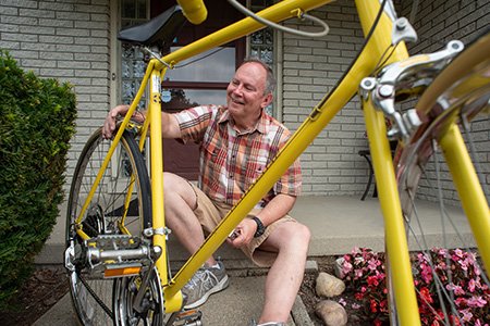 man working on his bike