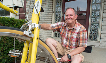 tom posed with his bike