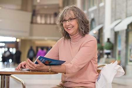 Lymphona Patient Elizabeth Dale reading health information booklet