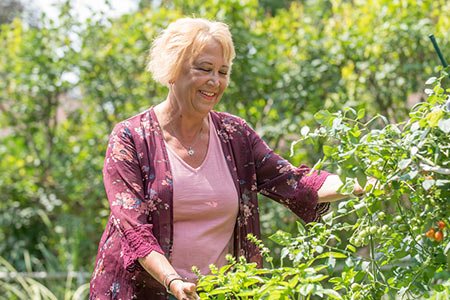 lung cancer patient working in her garden