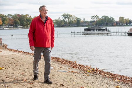 cancer patient walking on the beach