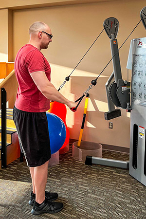 Spine cancer patient at the rehab gym