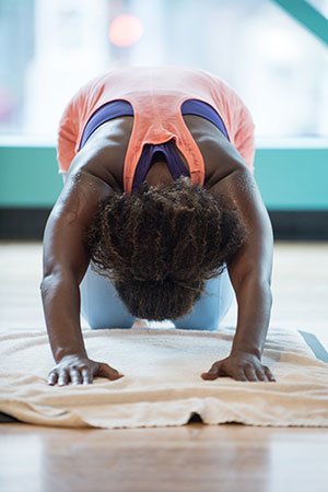 woman doing yoga laying down