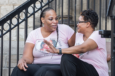 cervical cancer patient wanda williams and sister sitting on stoop