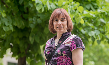 Heart patient Michelle Rachuk standing in front of trees