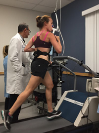 woman running on treadmill