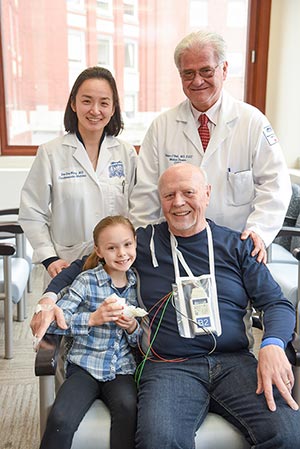 structural heart patient dennis posed with physicians and family member