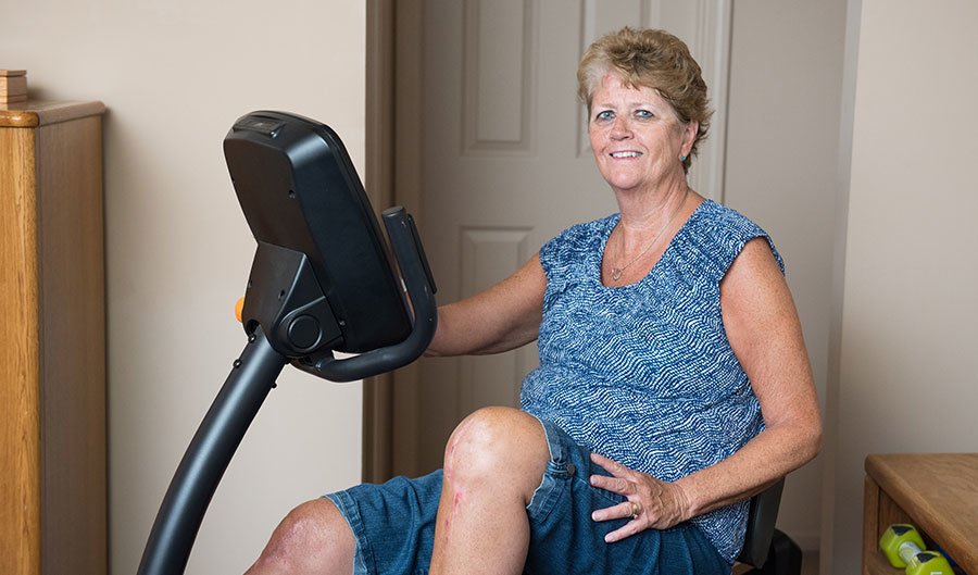 joint replacement patient jill pittman on exercise bike