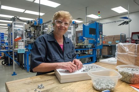 Joint Replacement patient Phyllis working at a table