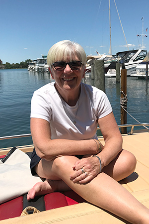 Marge sitting on a boat dock