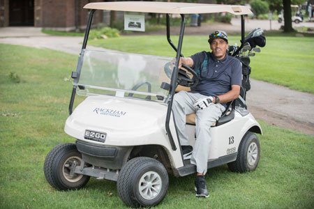 sports medicine patient rashad in a golf cart