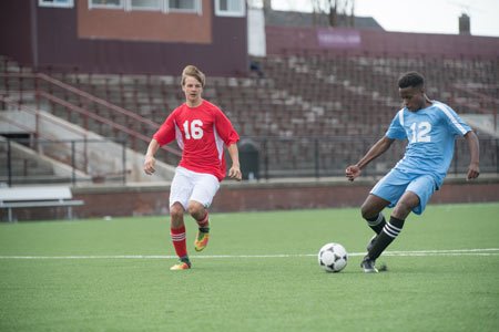 students playing soccer