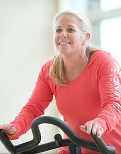 weight loss patient natalie riding exercise bike