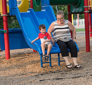 weight loss patient Linda and son on slide