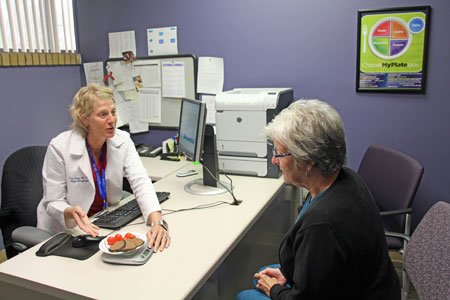 weight management patient discussing program with doctor