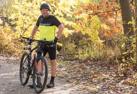 weight management patient mark hofman with his bike