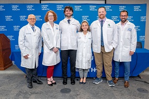 Erin, Mohamed and Joey standing with transplant doctors 