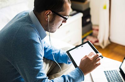 man with headphone and tablet
