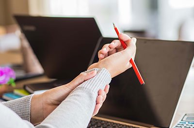 woman holding her wrist