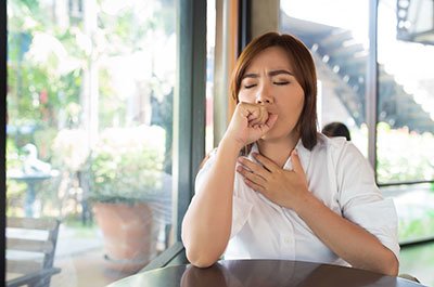 woman coughing