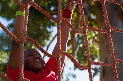 boy climbing rope