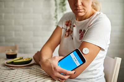 woman checking blood sugar