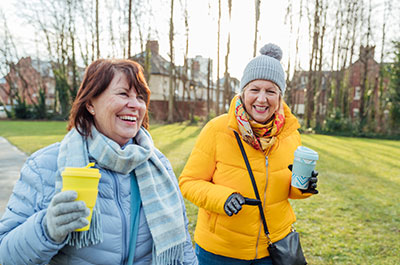 women walking and talking