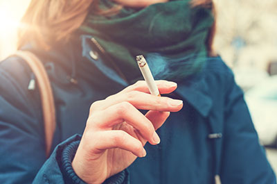 woman smoking outside