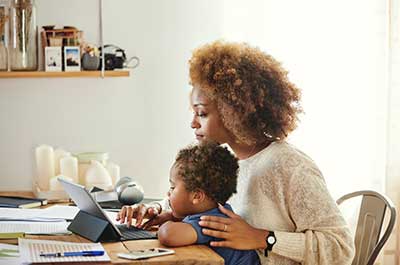 Mother and son on laptop