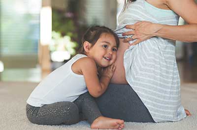 Pregnant mom with child