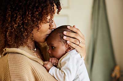 mother holding baby