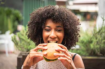 woman eating hambuger