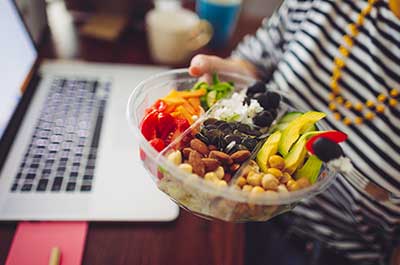person eating snacks during work