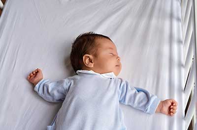 baby sleeping in crib